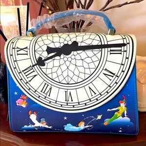 DisneyX Loungefly Peter Pan Crossbody bag. New with tags. Glow in the dark clock